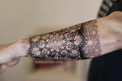 Tattoo artist Kirk Nilsen combines strong lines and ethereal dot work to create a contrast of textures in this sacred geometry tattoo
