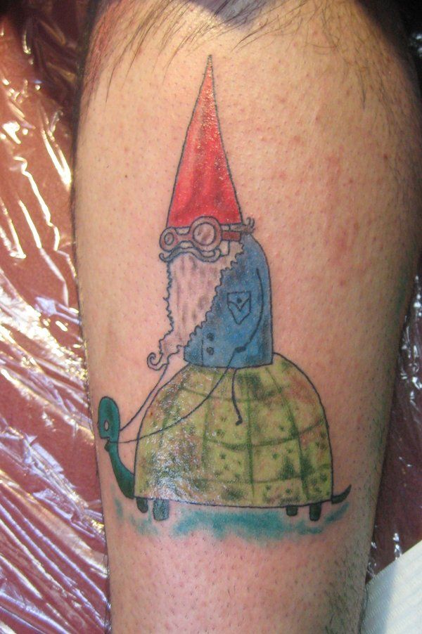 While this gnome tattoo shows a gnome with a pointy red hat and a blue jacket, just like in the TV series, the style of the illustration is unique