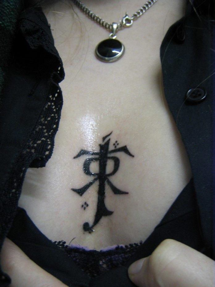 This tattoo shows JRR Tolkien's signature symbol that he used when signing his name as an author