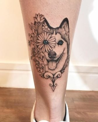 José Audi has given this calf tattoo of an alaskan husky a collection of flowers and mandalas both to decorate and commemorate the beloved pet.