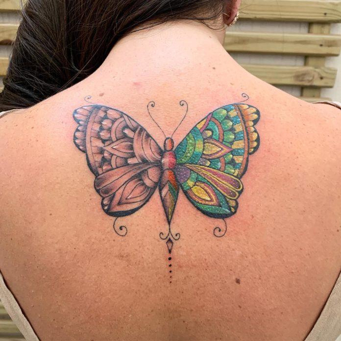 This half color ink and half black ink butterfly tattoo by José Flávio Audi shows off the tattoo artist's skills with both design and tattooing.
