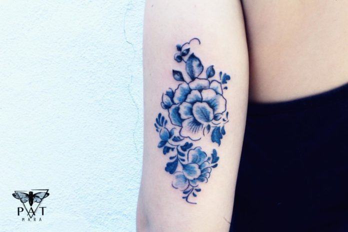Patrícia Mara has used a deep cobalt blue tattoo ink that creates a high contrast against her client's porcelain white skin