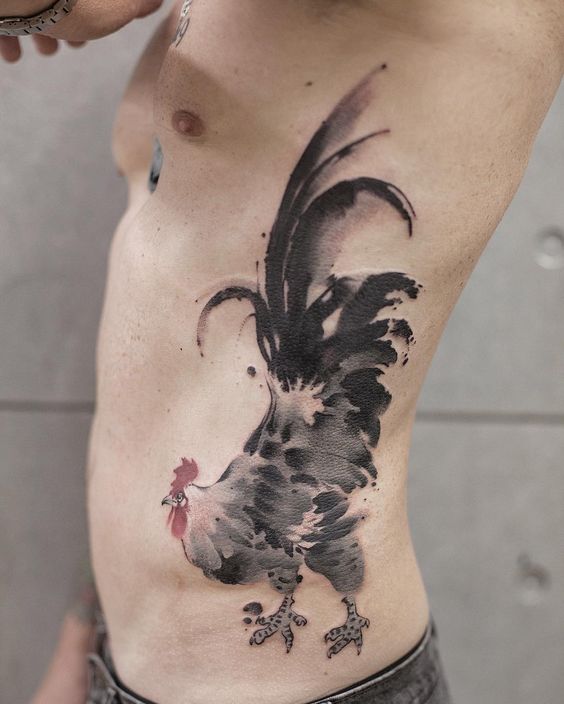 This exquisite tattoo of a rooster is by Chinese tattoo artist Chen Jie, who has used a traditional Chinese ink illustration style. The tattoo beautifully mimics the painted brushstrokes used in the original ink design. The artist has also skilfully copied the subtle nature of watered-down ink.